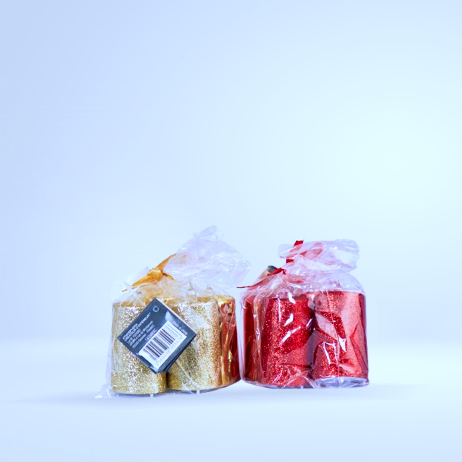 Duo bougies bâtons pailletées (or/rouge, emballées)